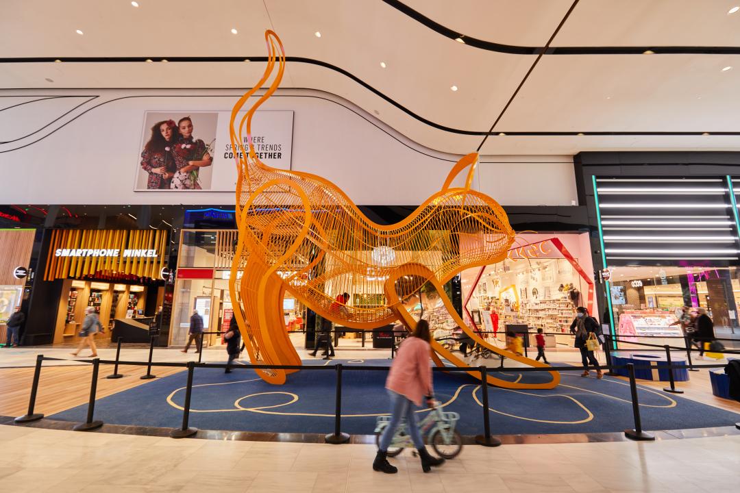 Big steel cat playground structure at shopping center