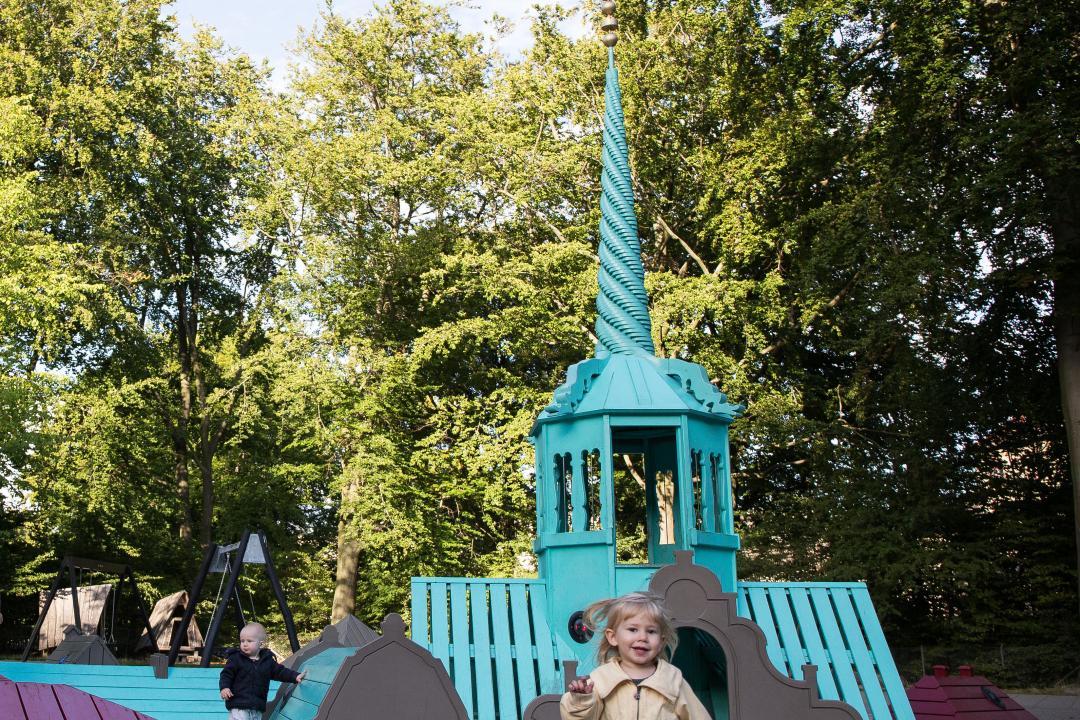 Girl running at tower playground