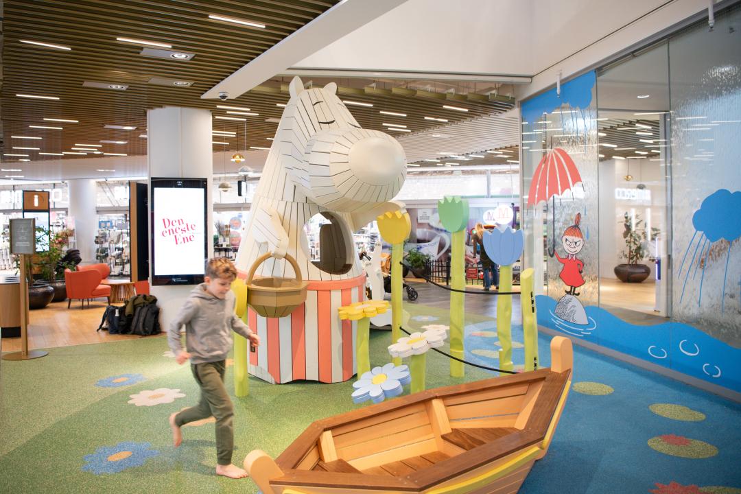 Boy playing at Moomin-themed playground