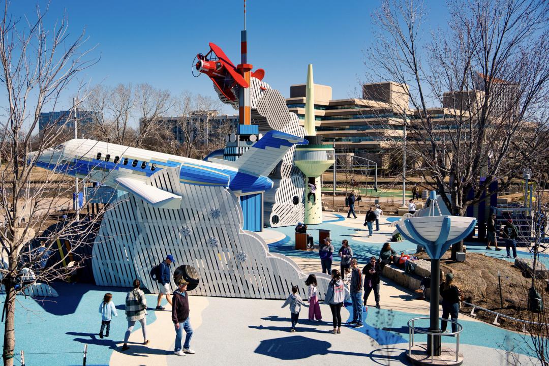 Wooden playground airplanes and rocket at adventure playscape at science center