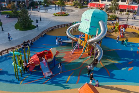 Aerial view of colourful wooden turtle and jellyfish playground 