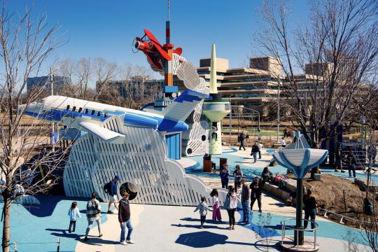 Wooden playground airplanes and rocket at adventure playscape at science center