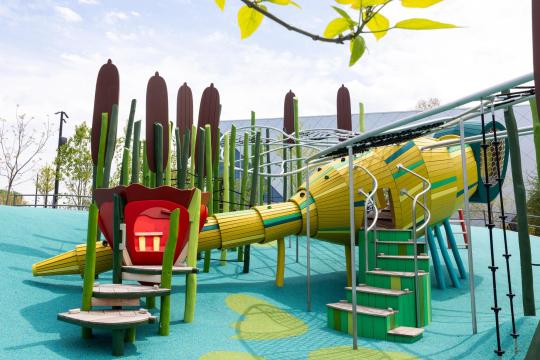 Huge wooden dragonfly playground structure at Obama Presidential Center