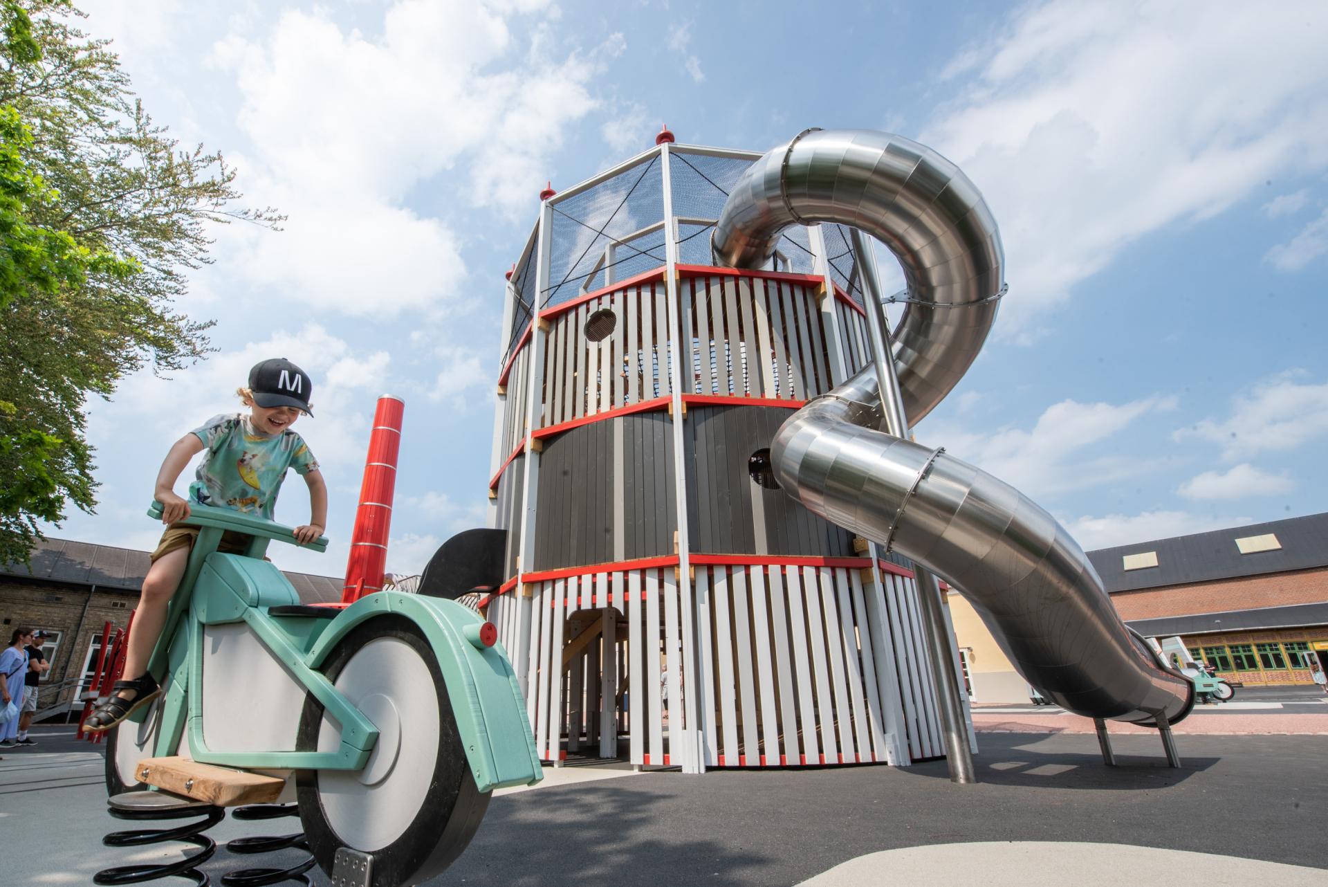 Boy playing on motorbike at MONSTRUM playground