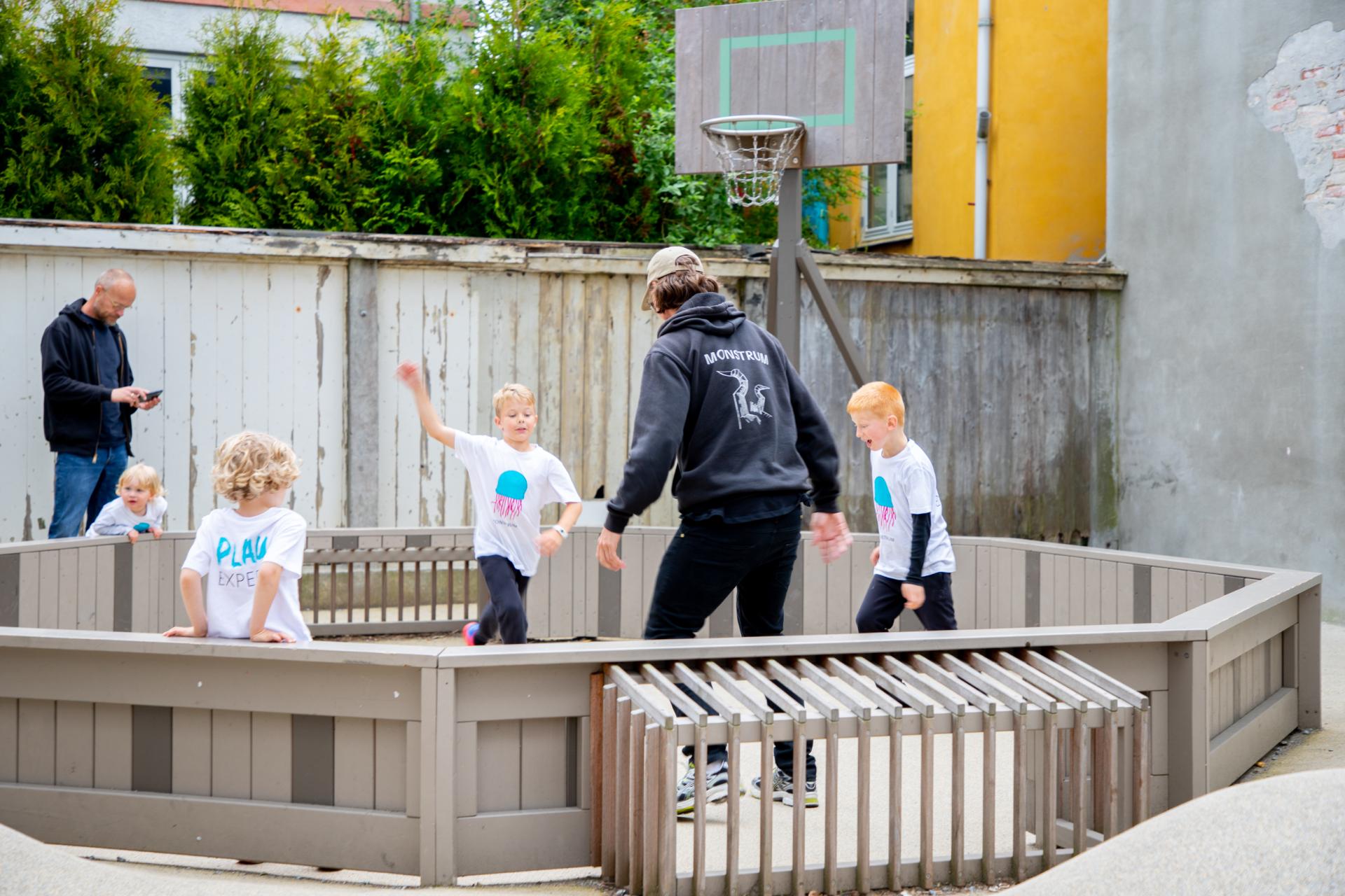 Boys playing football at playground