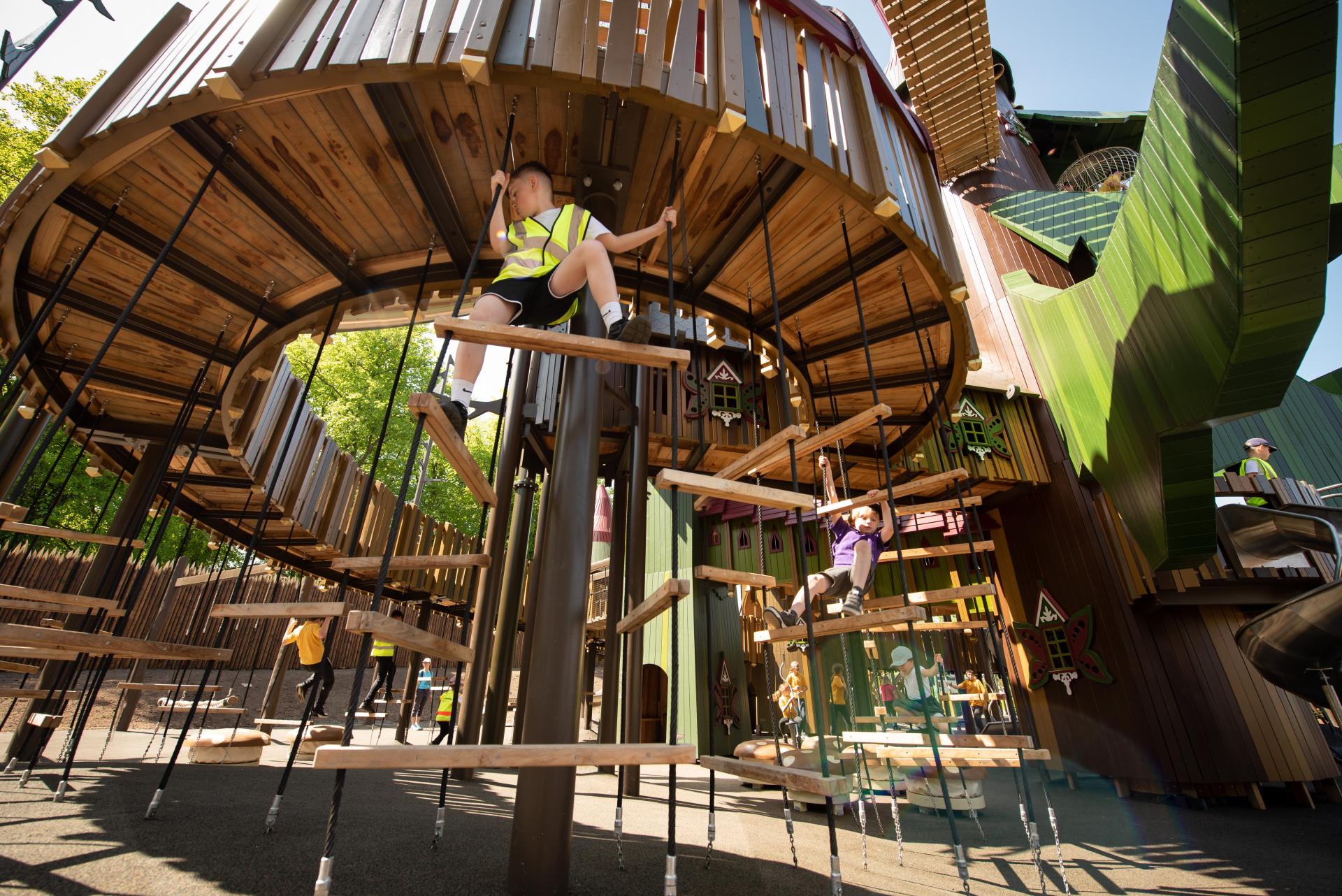 Kids climbing on playground structure at Lilidorei