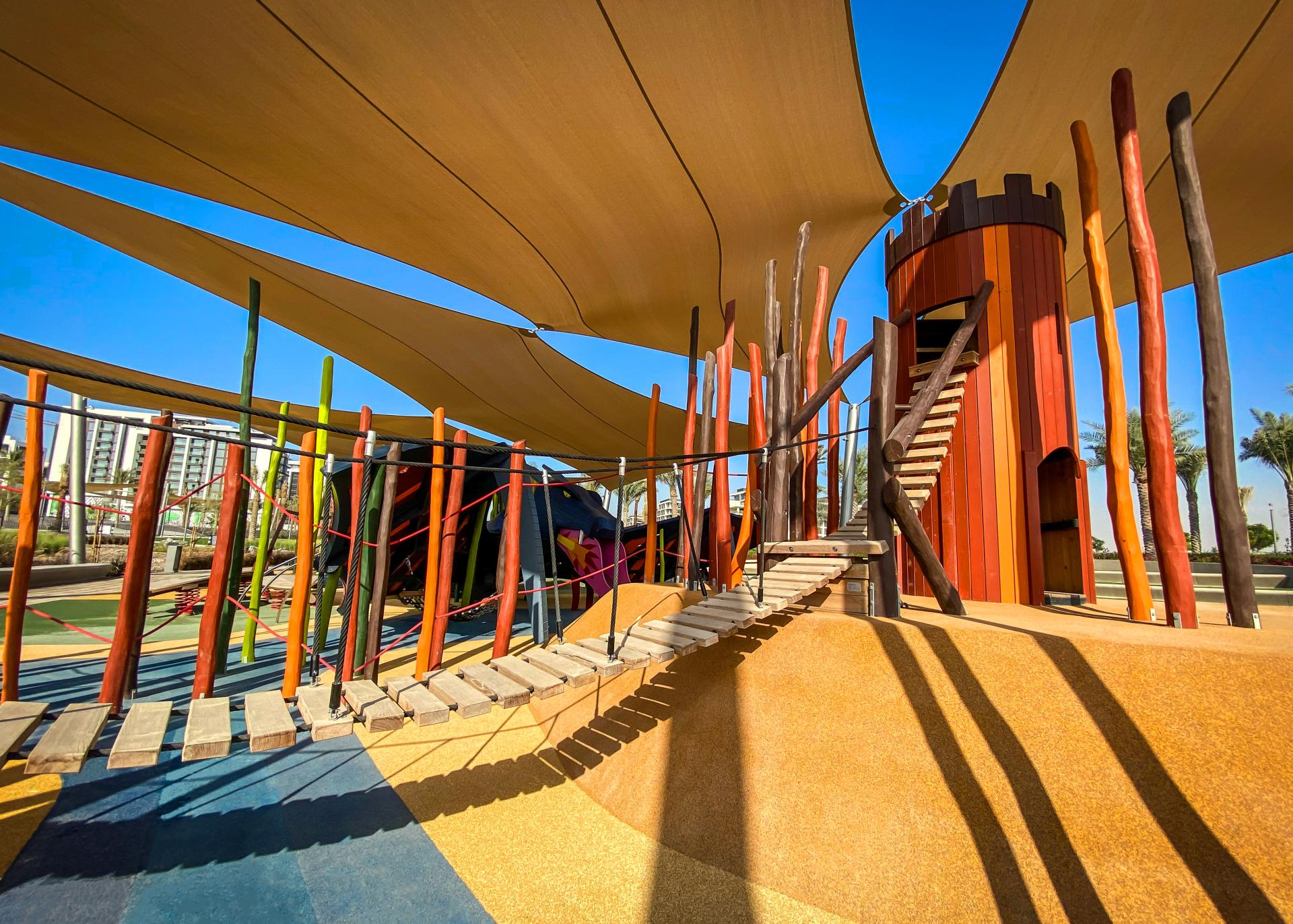 The tower set on fire across form the dragon MONSTRUM playgrounds Blazing Battle of the Dragon Dubai Hills Park