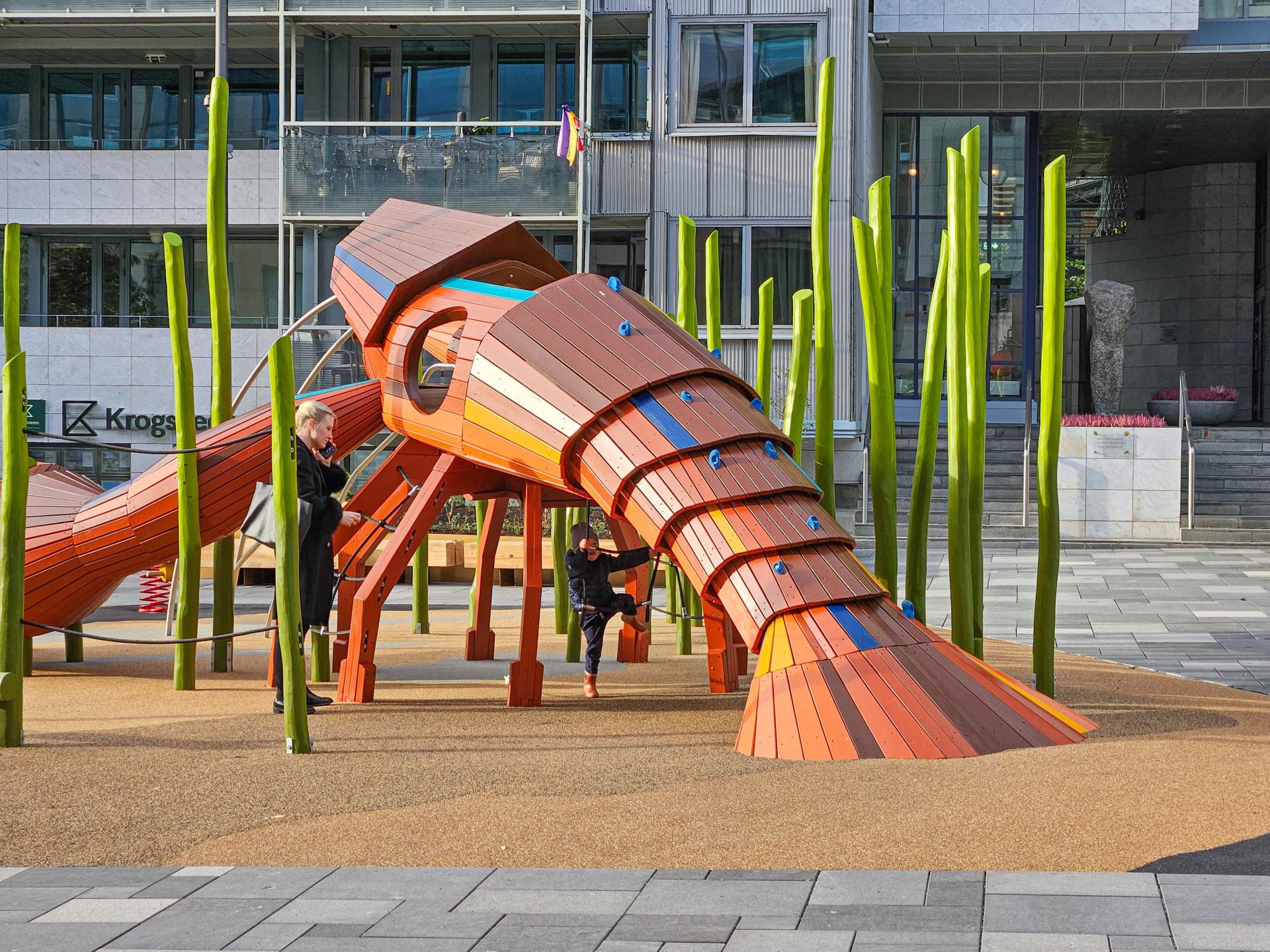 Back view of a lobster play structure at MONSTRUM playground