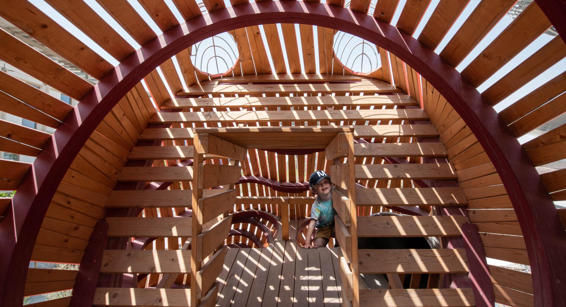 Boy playing in octopus playground, MONSTRUM Expo 2020