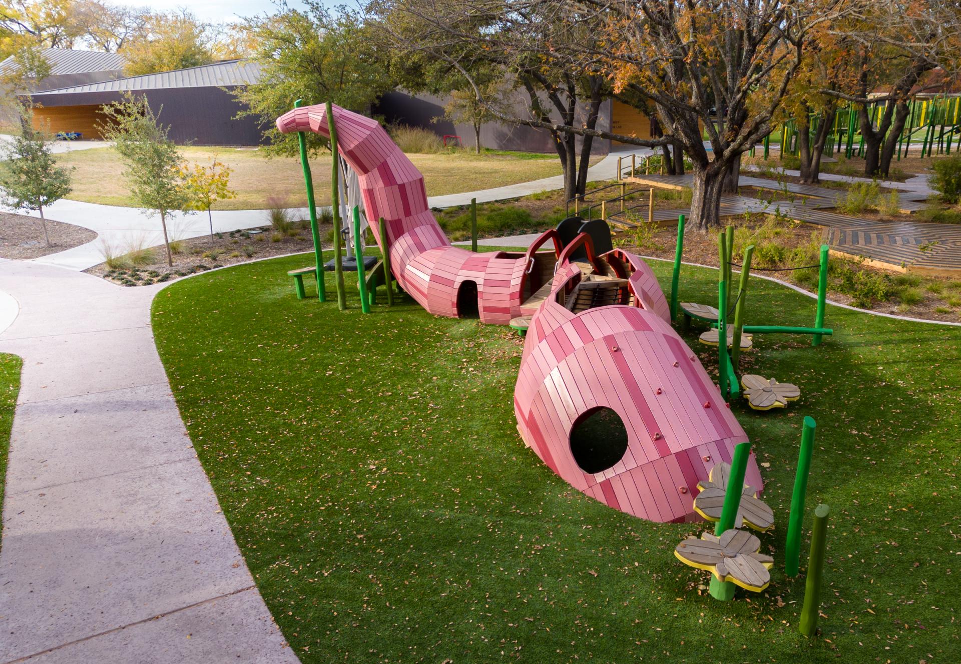 Huge wooden earthworm playground feature