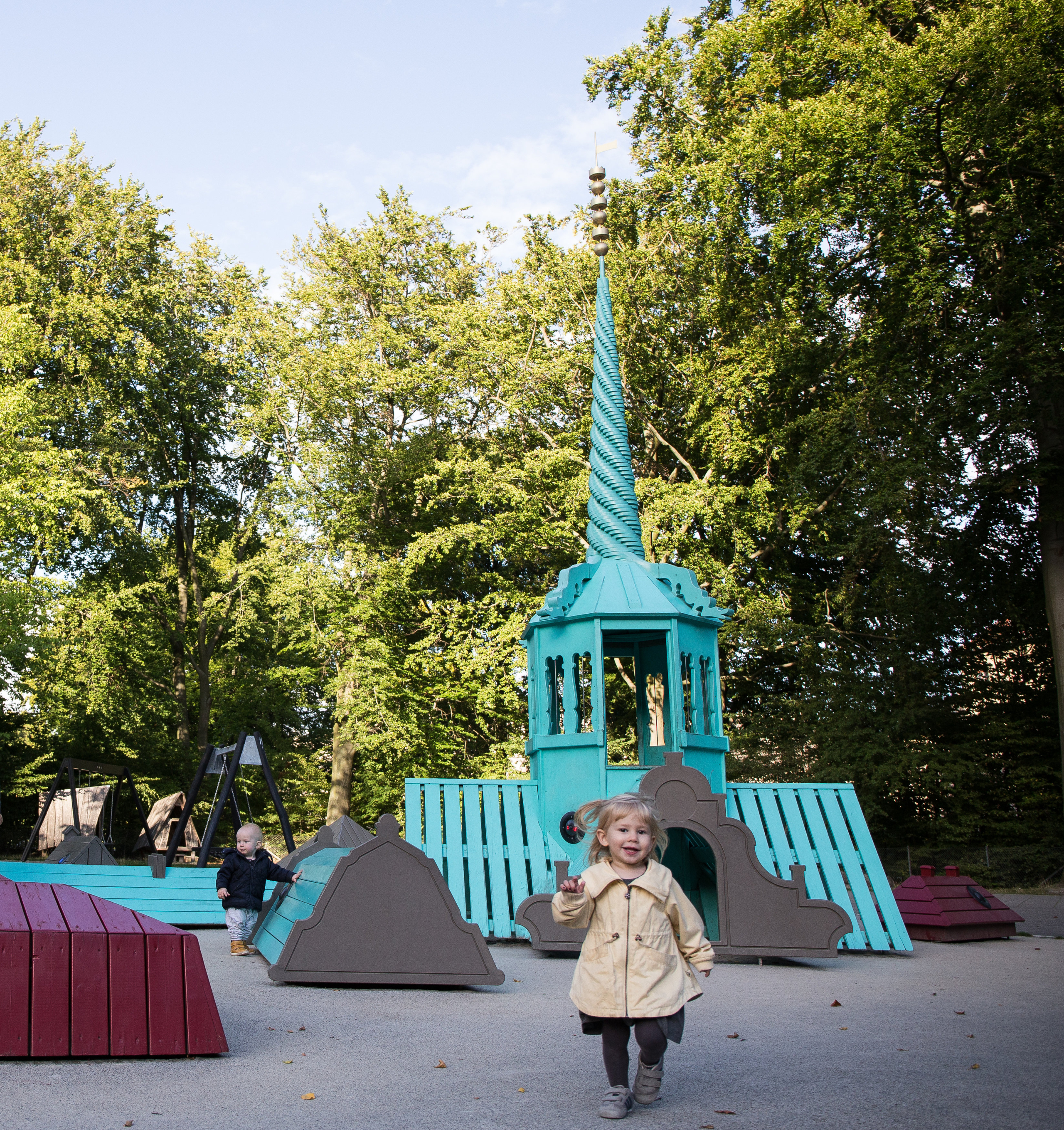 Girl running at tower playground