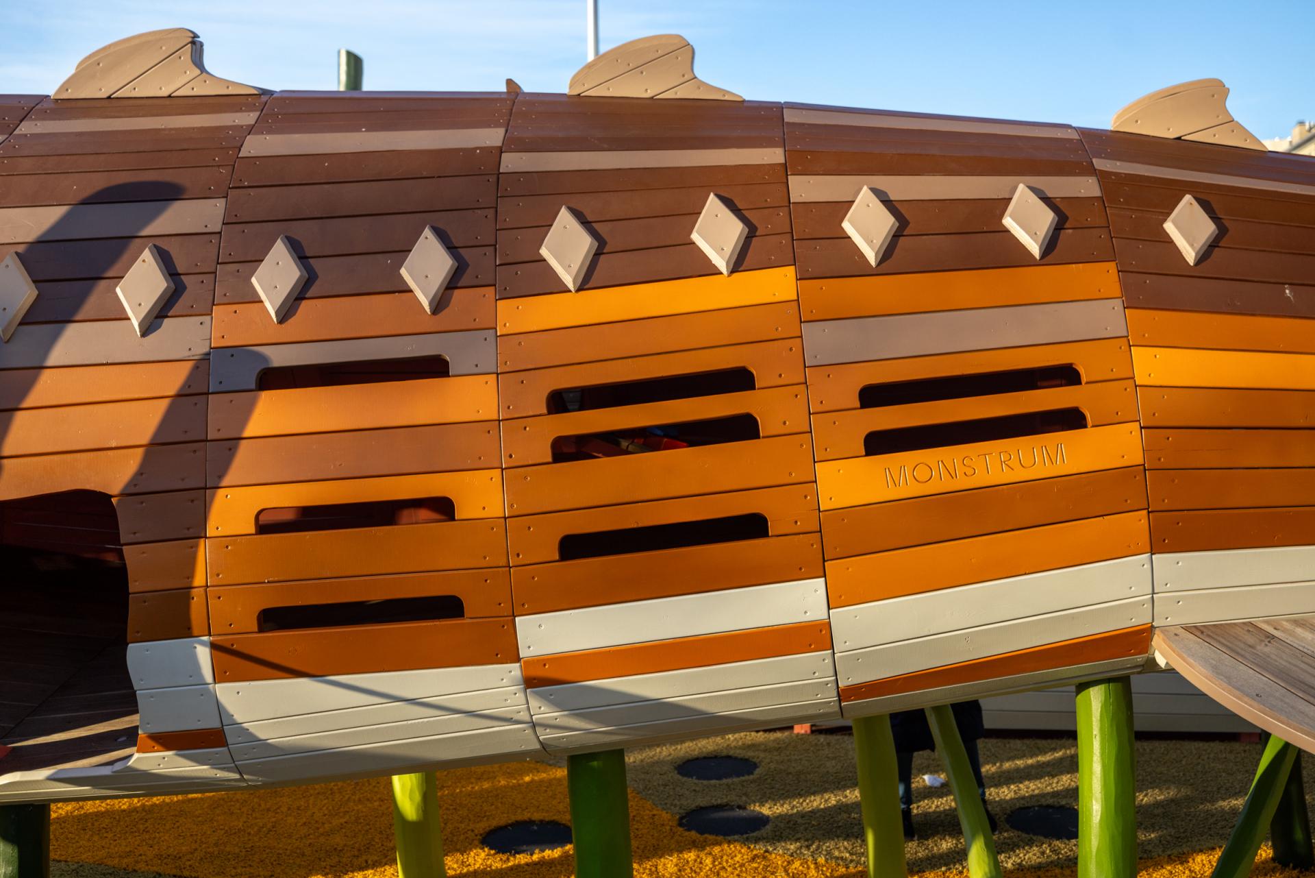 Close up of giant wooden sturgeon playground sculpture