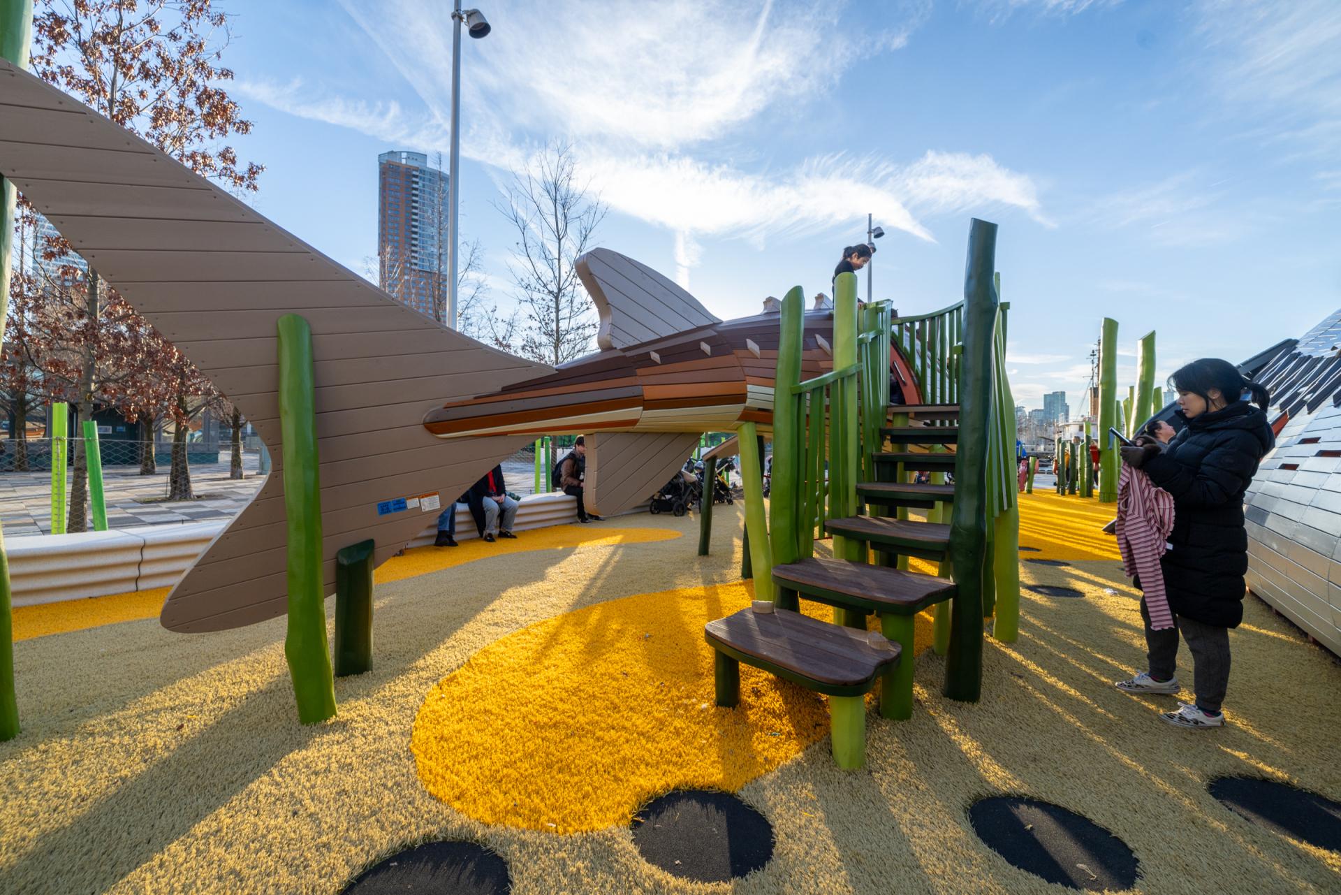 The tail end of a huge wooden sturgeon playground structure