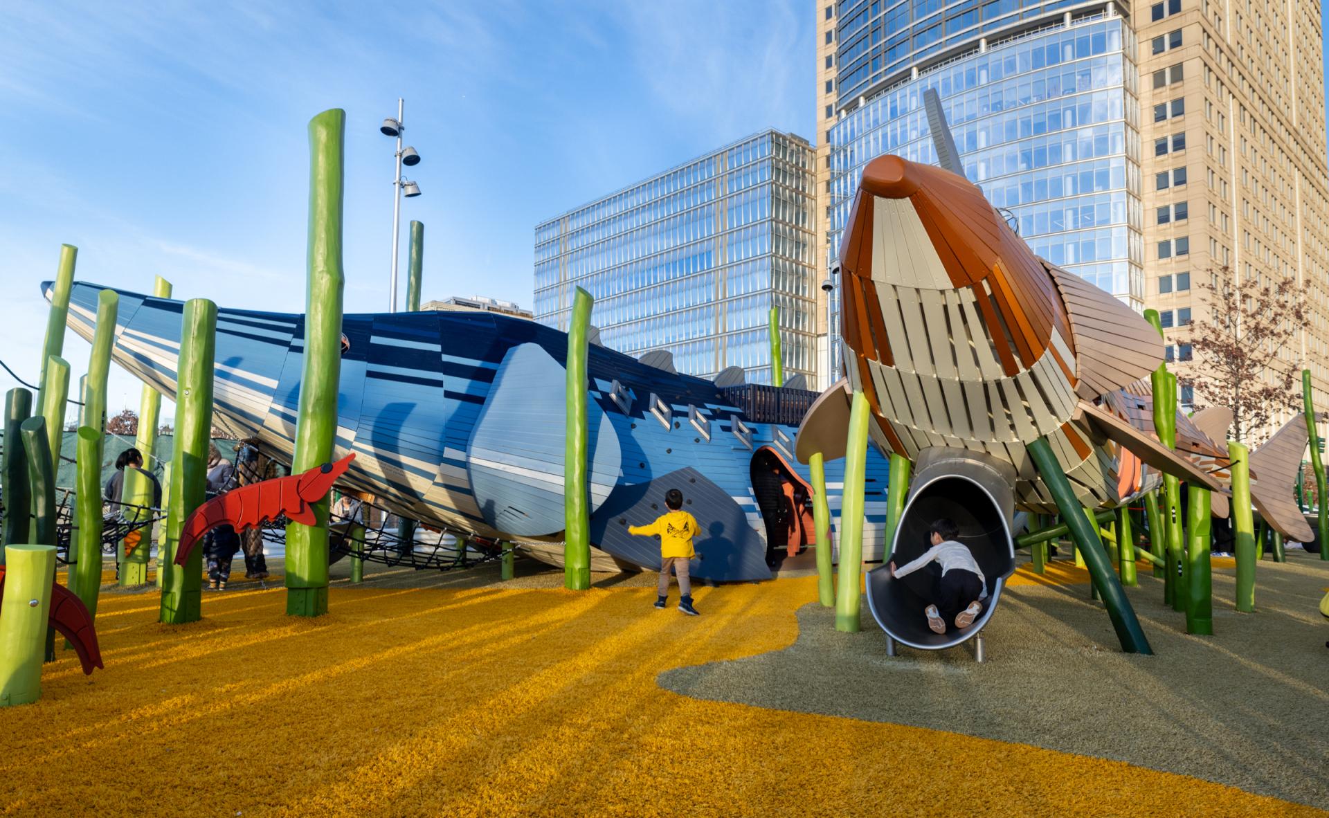 Two wooden sturgeon playground structures at Pier 26, New York