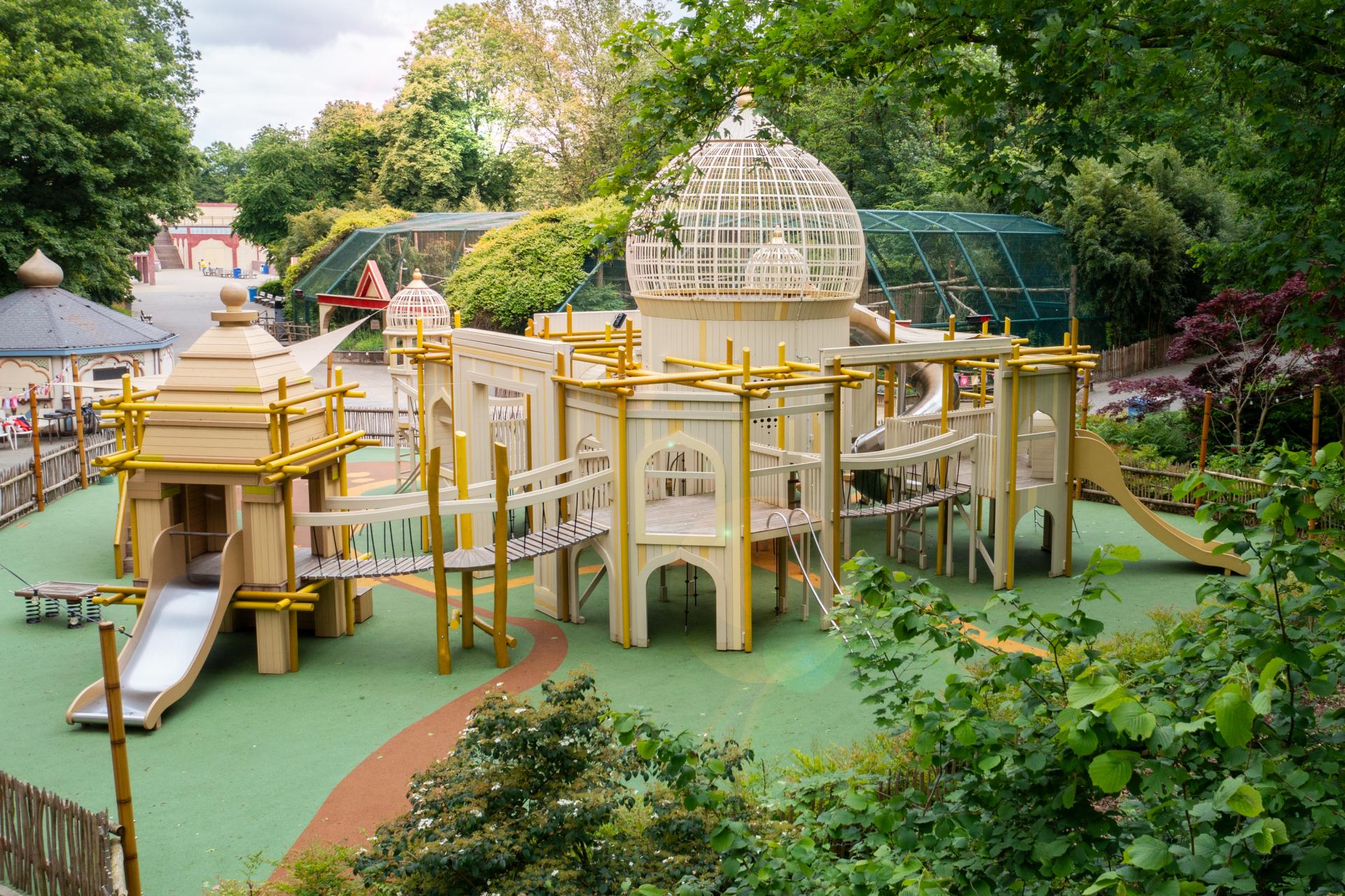 Wide shot of Hampi temple-themed playground 