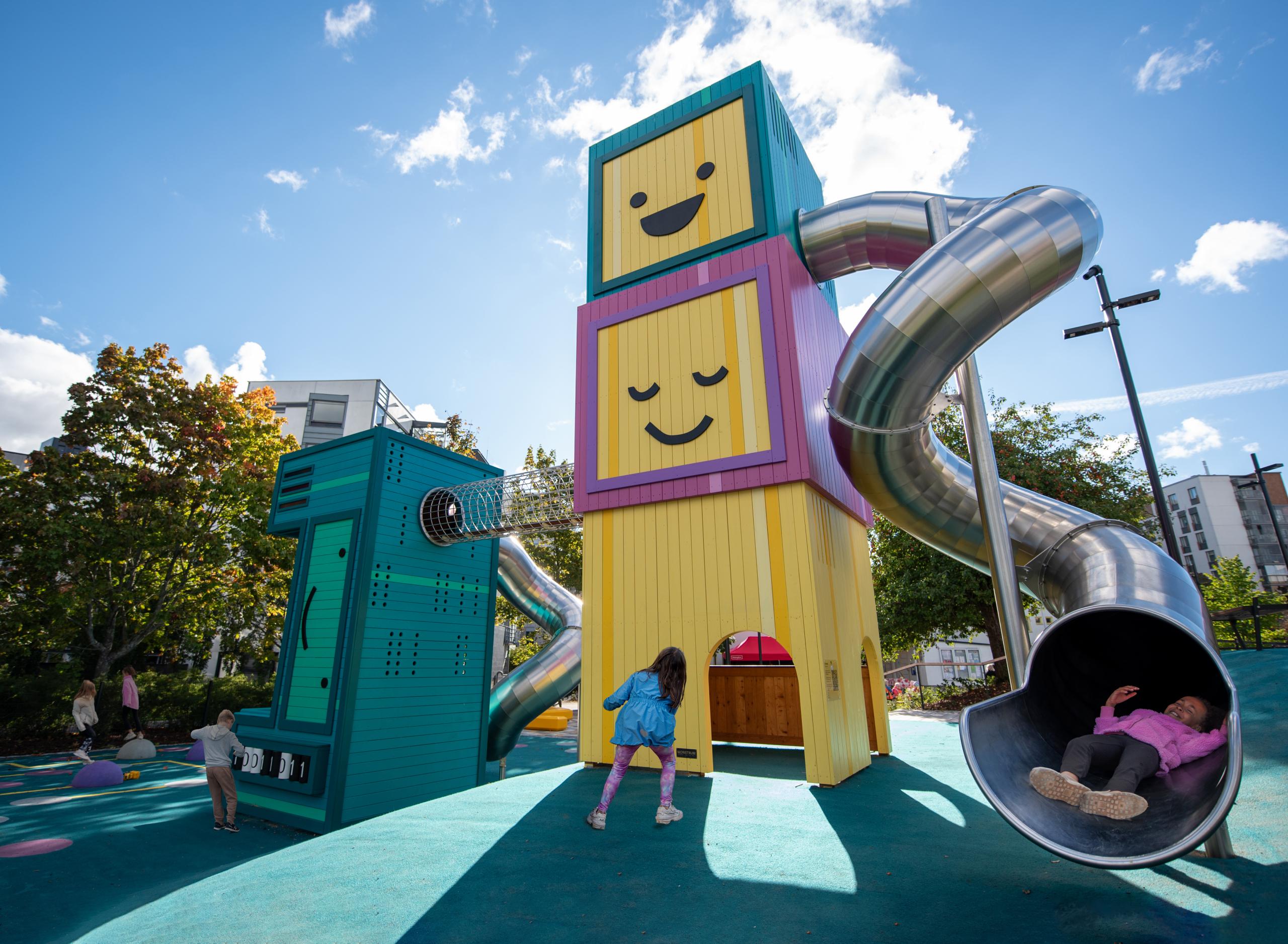 Wooden computer-themed playground with kids playing