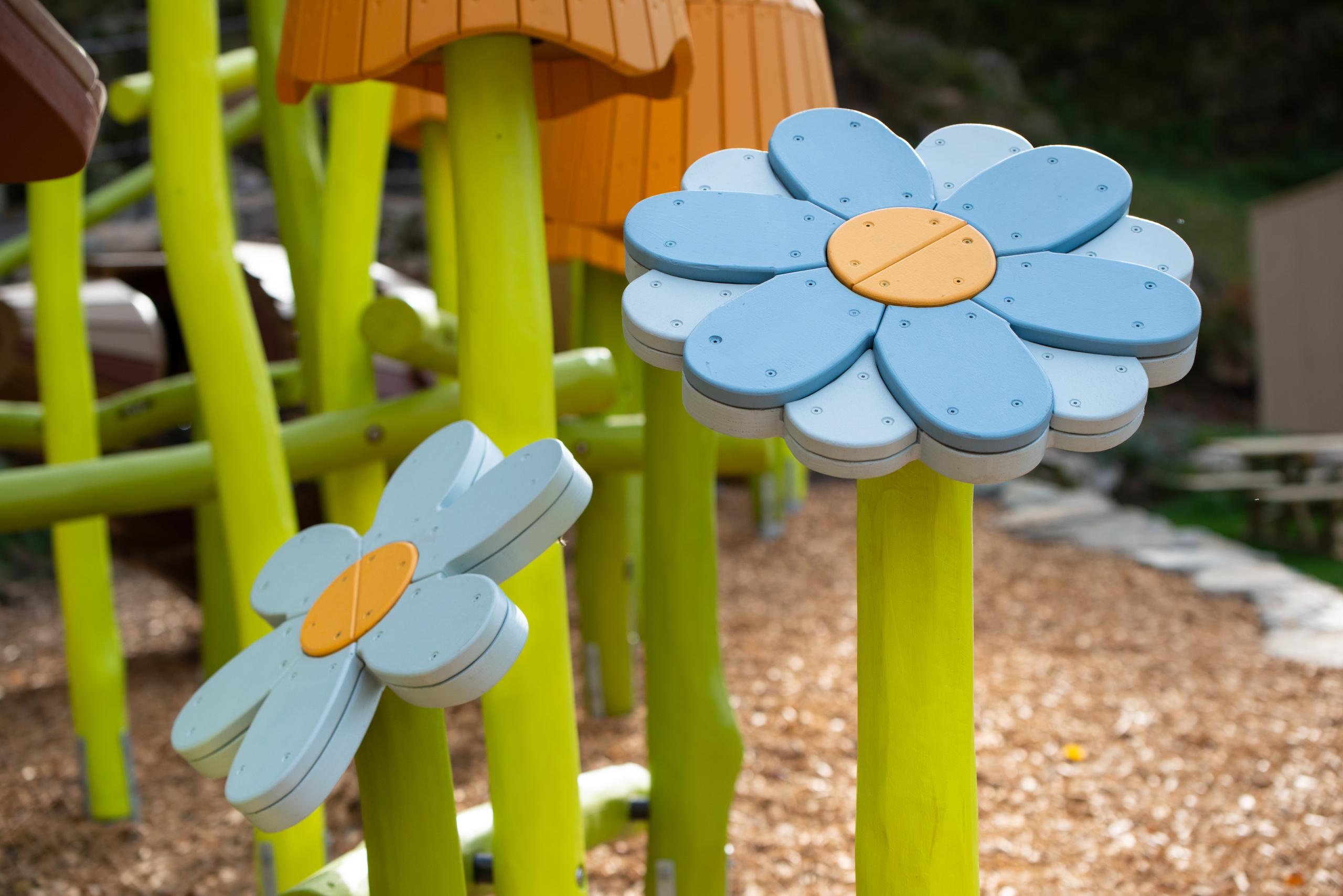 Wooden artistic flowers at playground