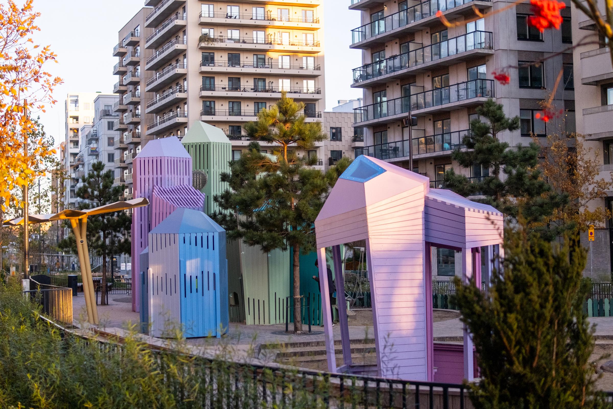 Wooden towers resembling colourful crystals