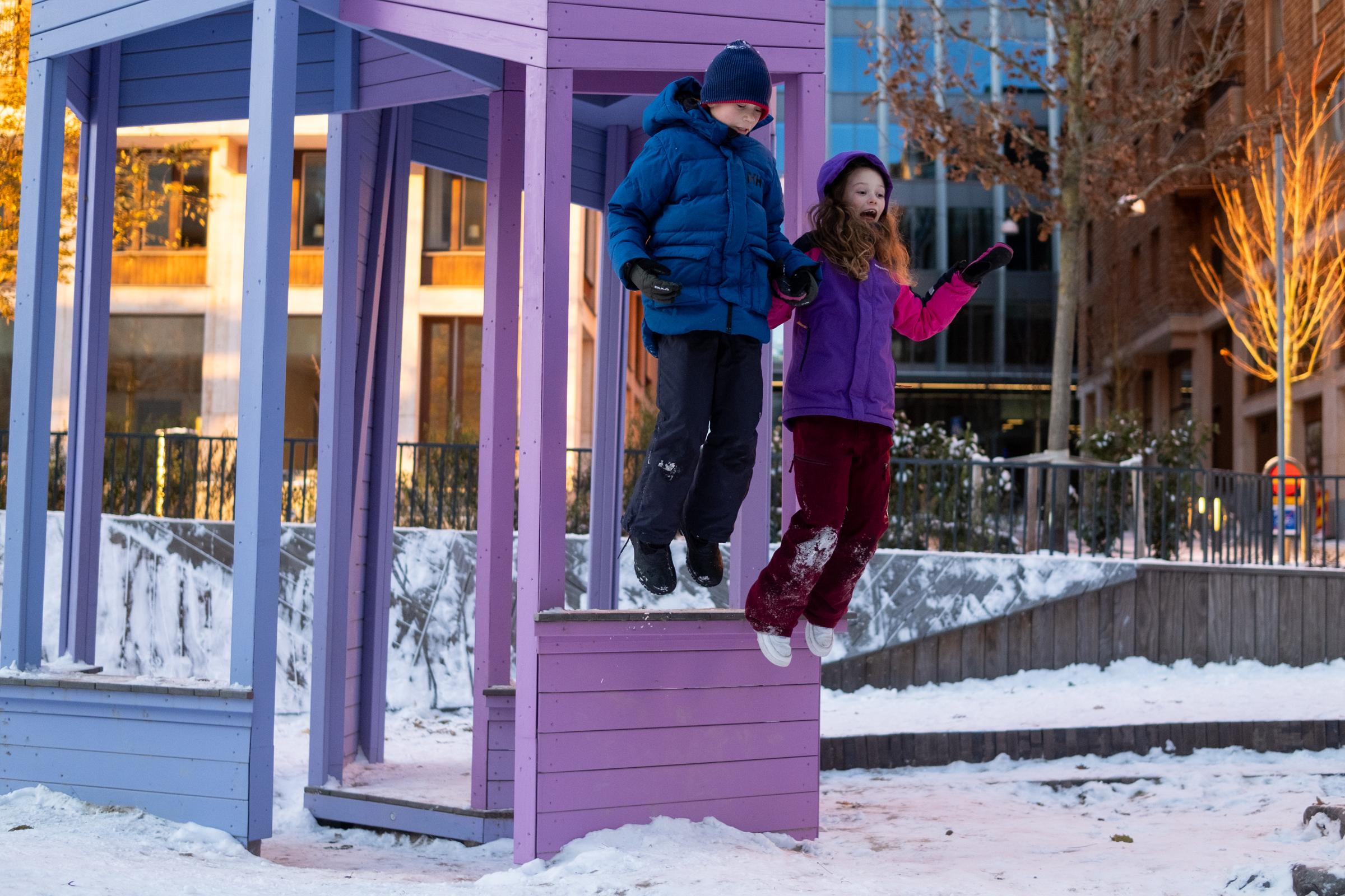 Kids jumping from playground tower