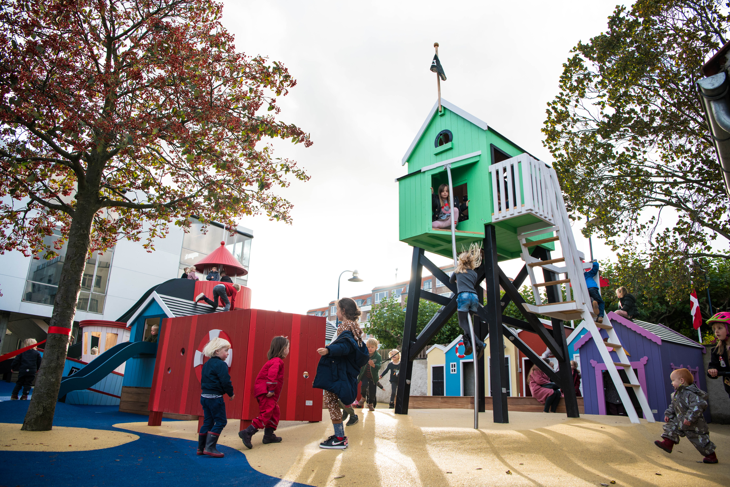 Children playing at creative school playground