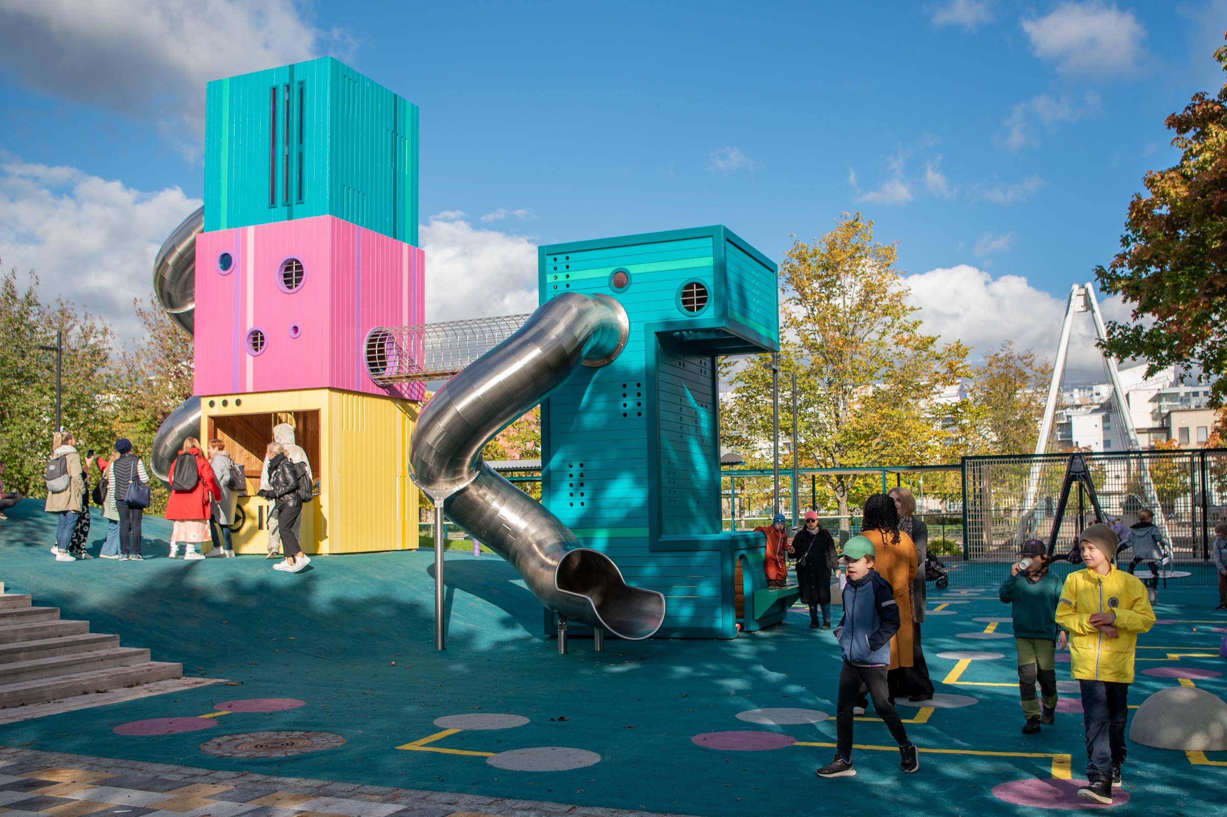 Computer-themed playground full of kids playing