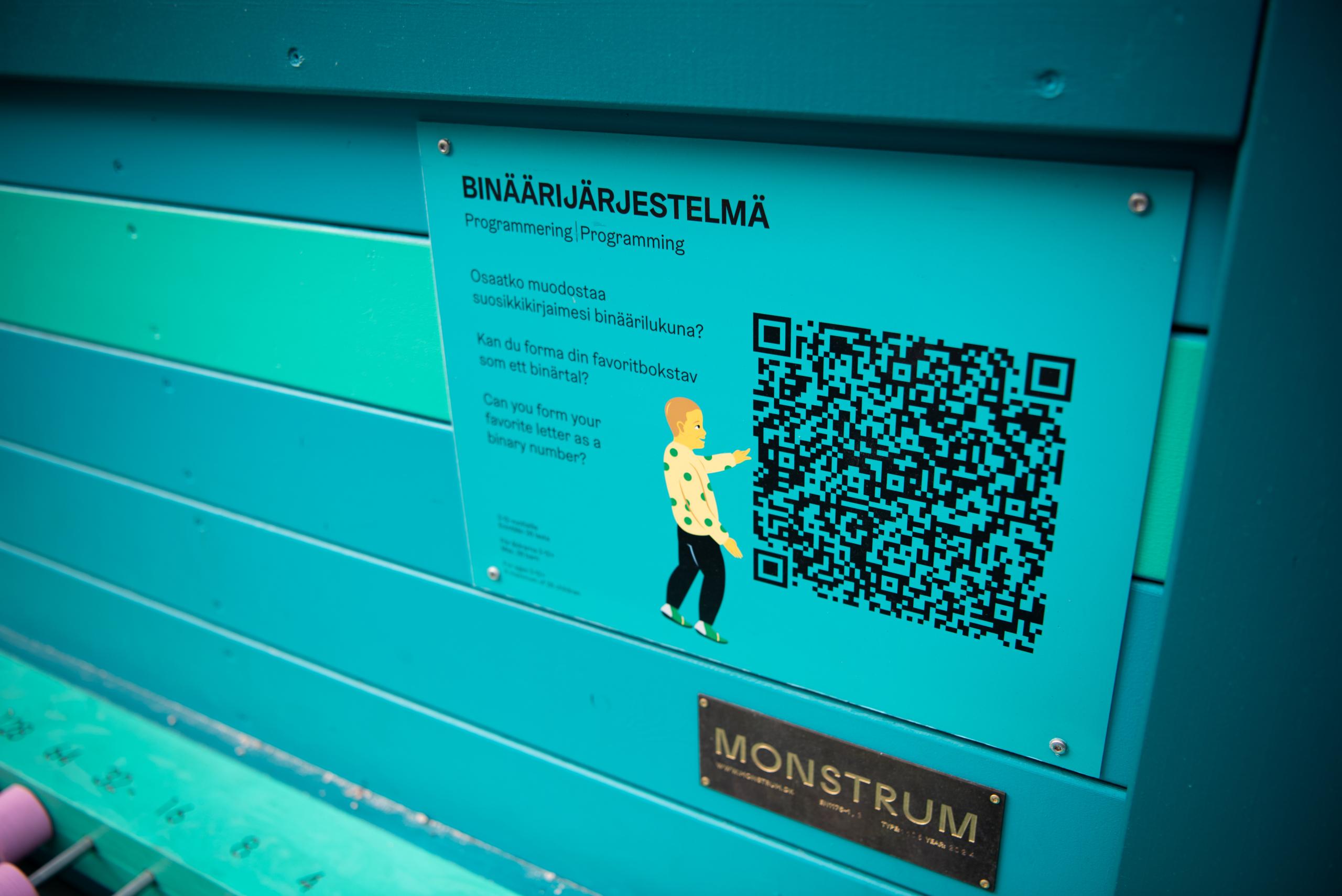 Information sign with a QR code at computer playground
