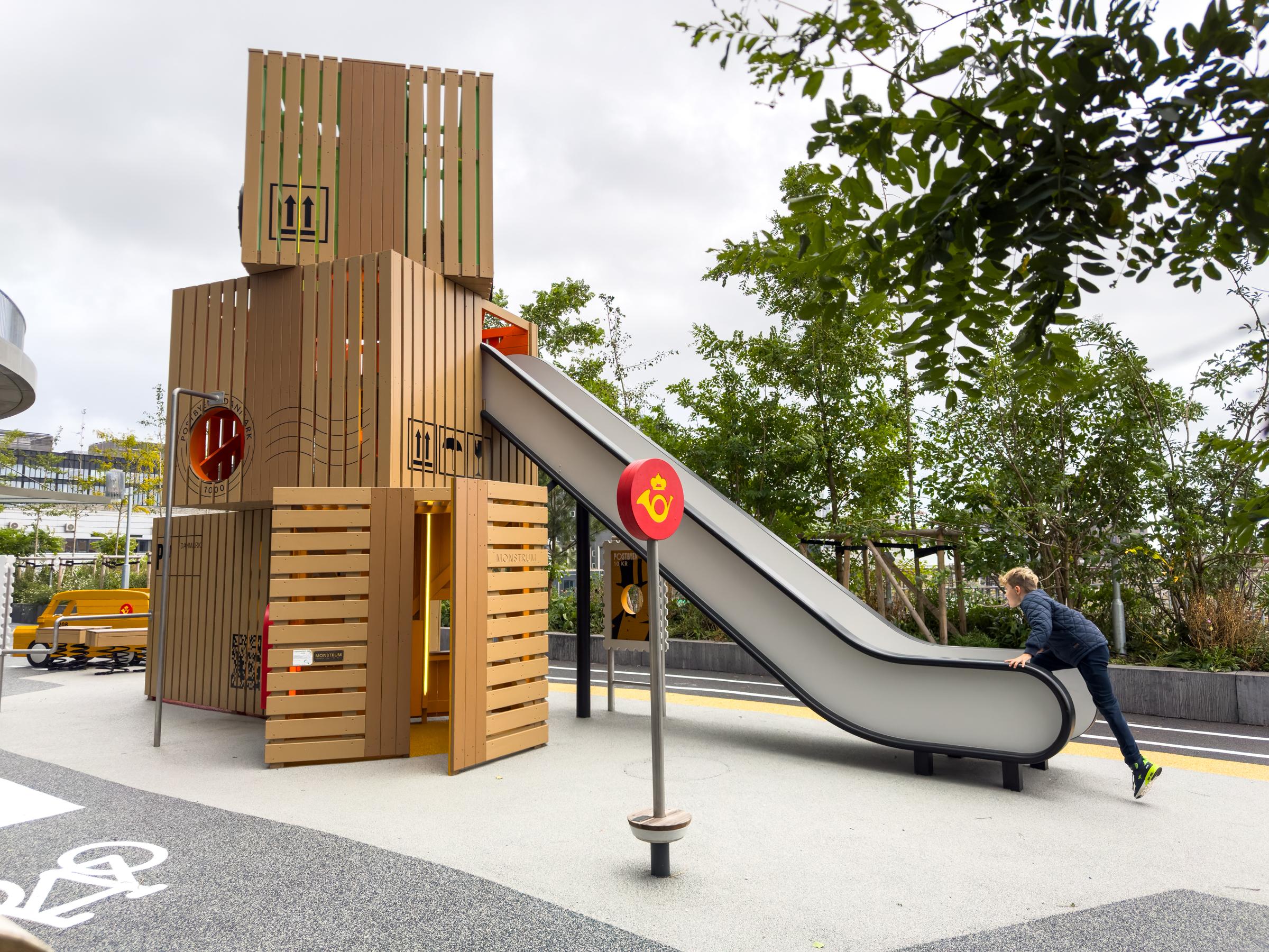 Boy climbing up playground slide