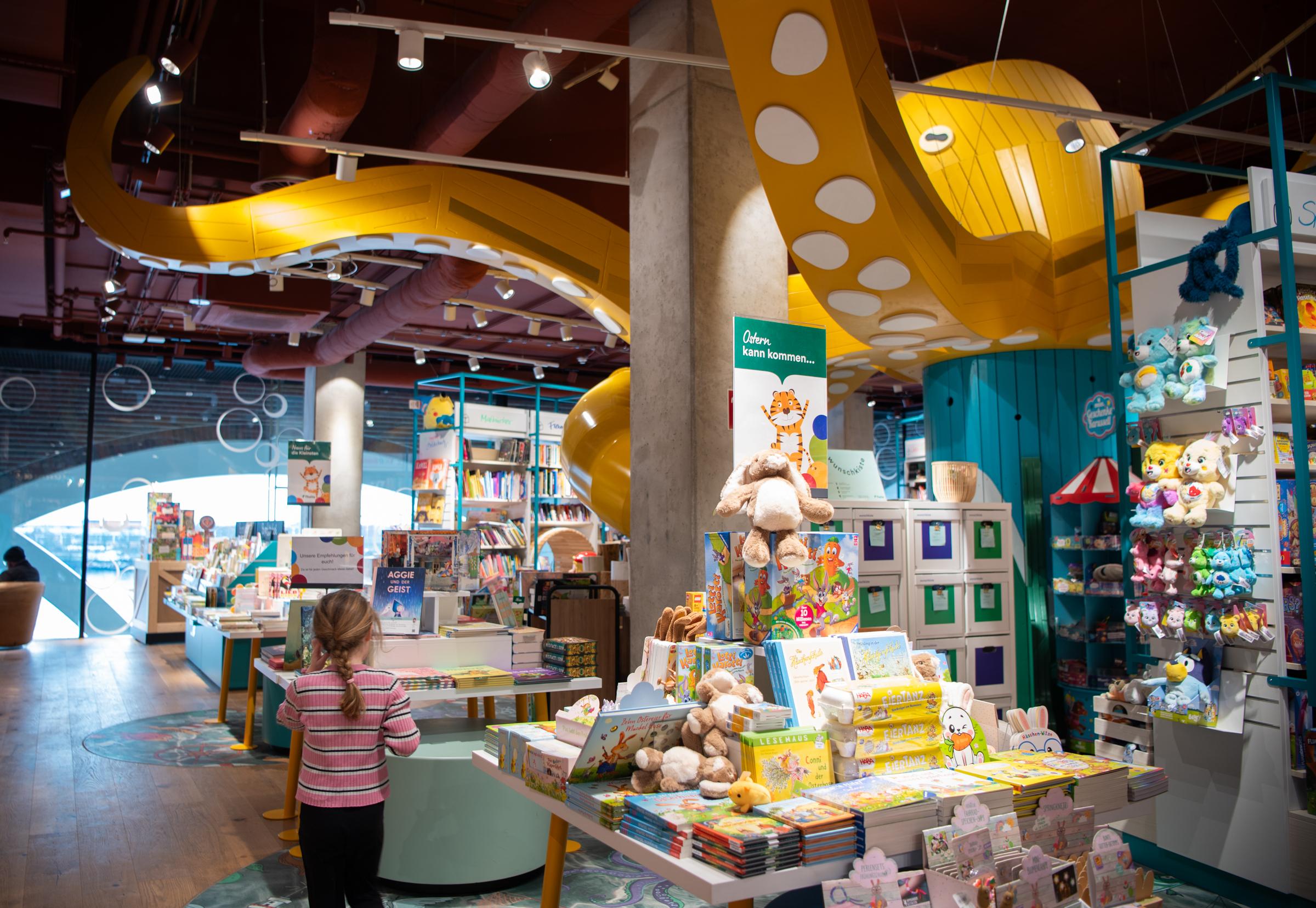 Girl at octopus playground in bookshop