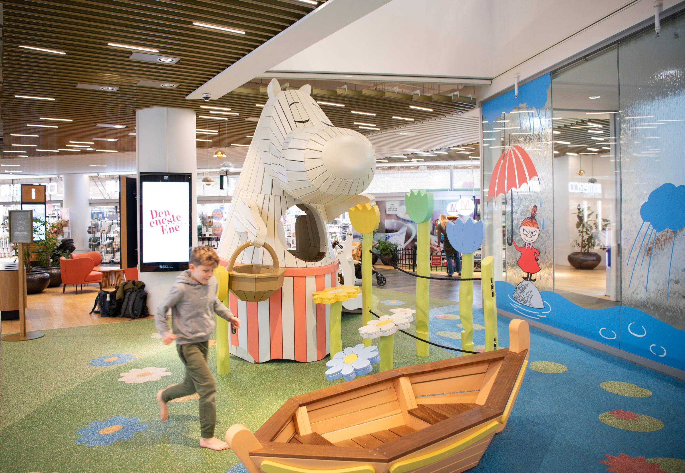 Boy playing at Moomin-themed playground