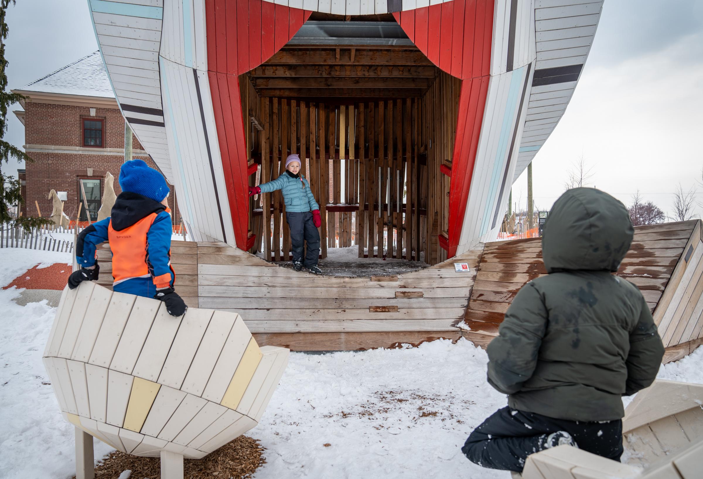 Kids playing on theatre stage at owl playground