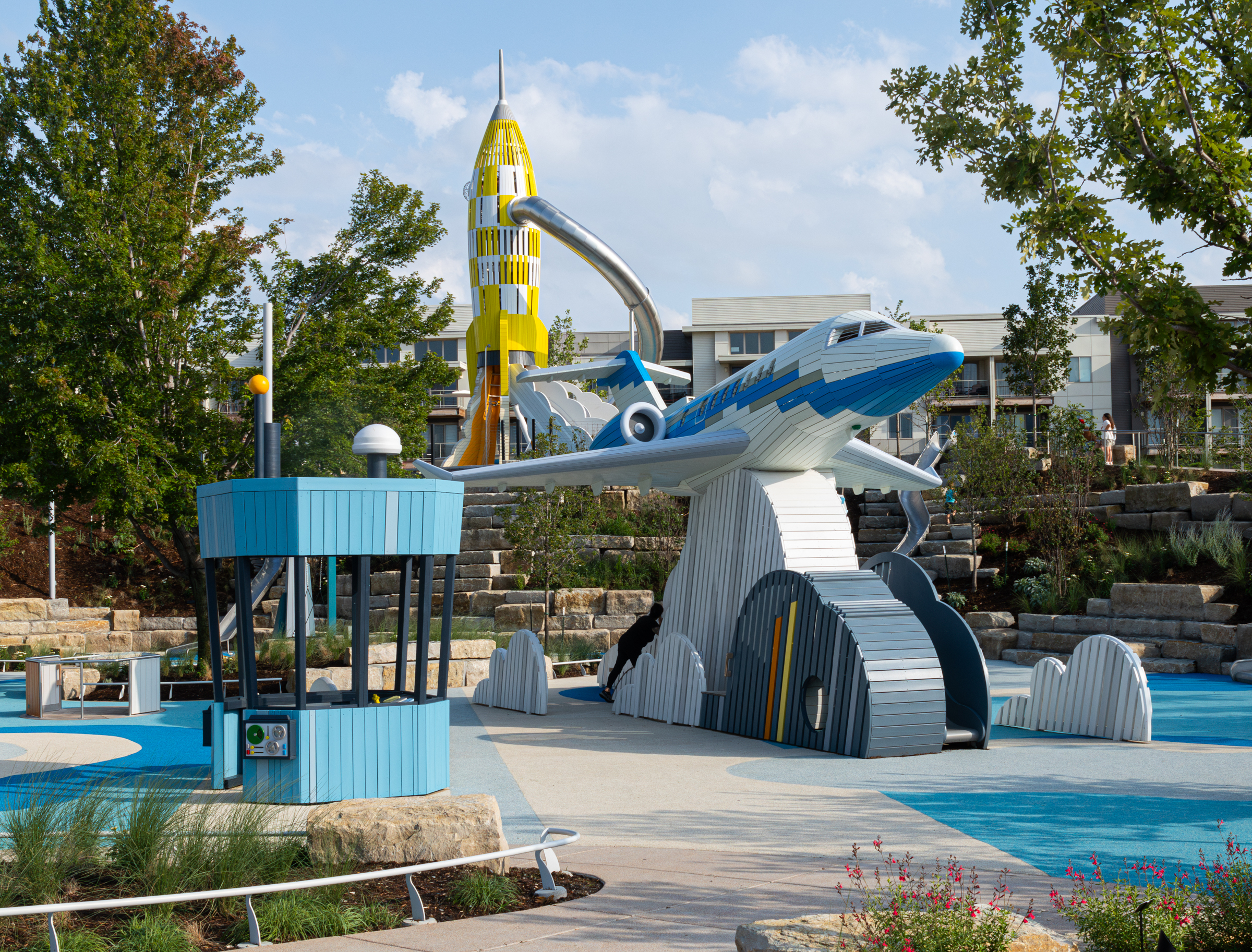 Playground in wood with big plane, rocket and radio tower