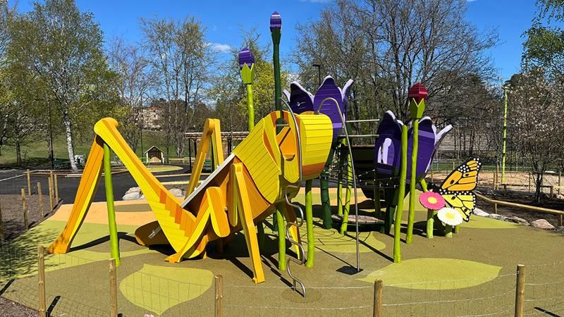 Artistic grasshopper and flowers playground