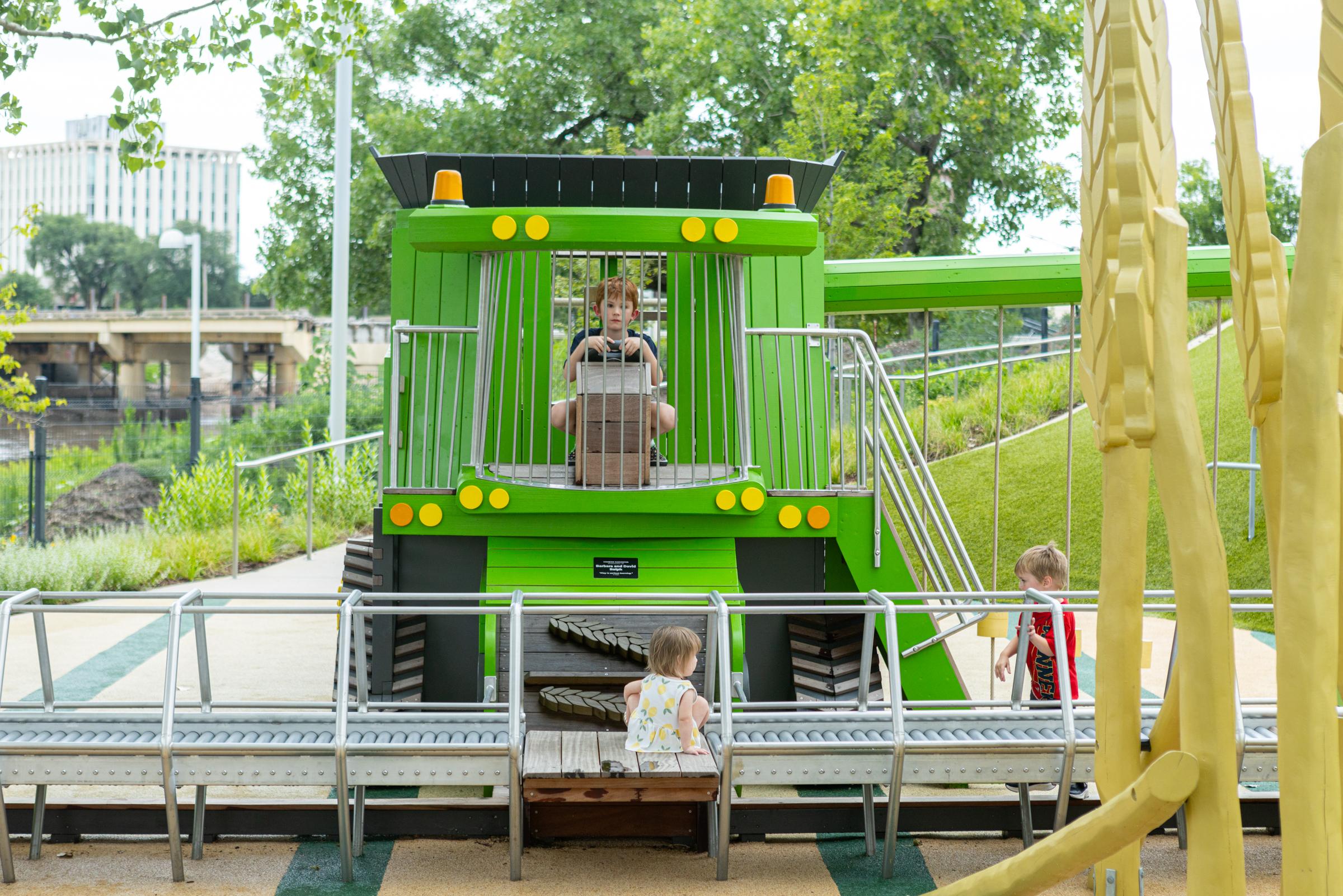 Kids playing on playground combine harvester