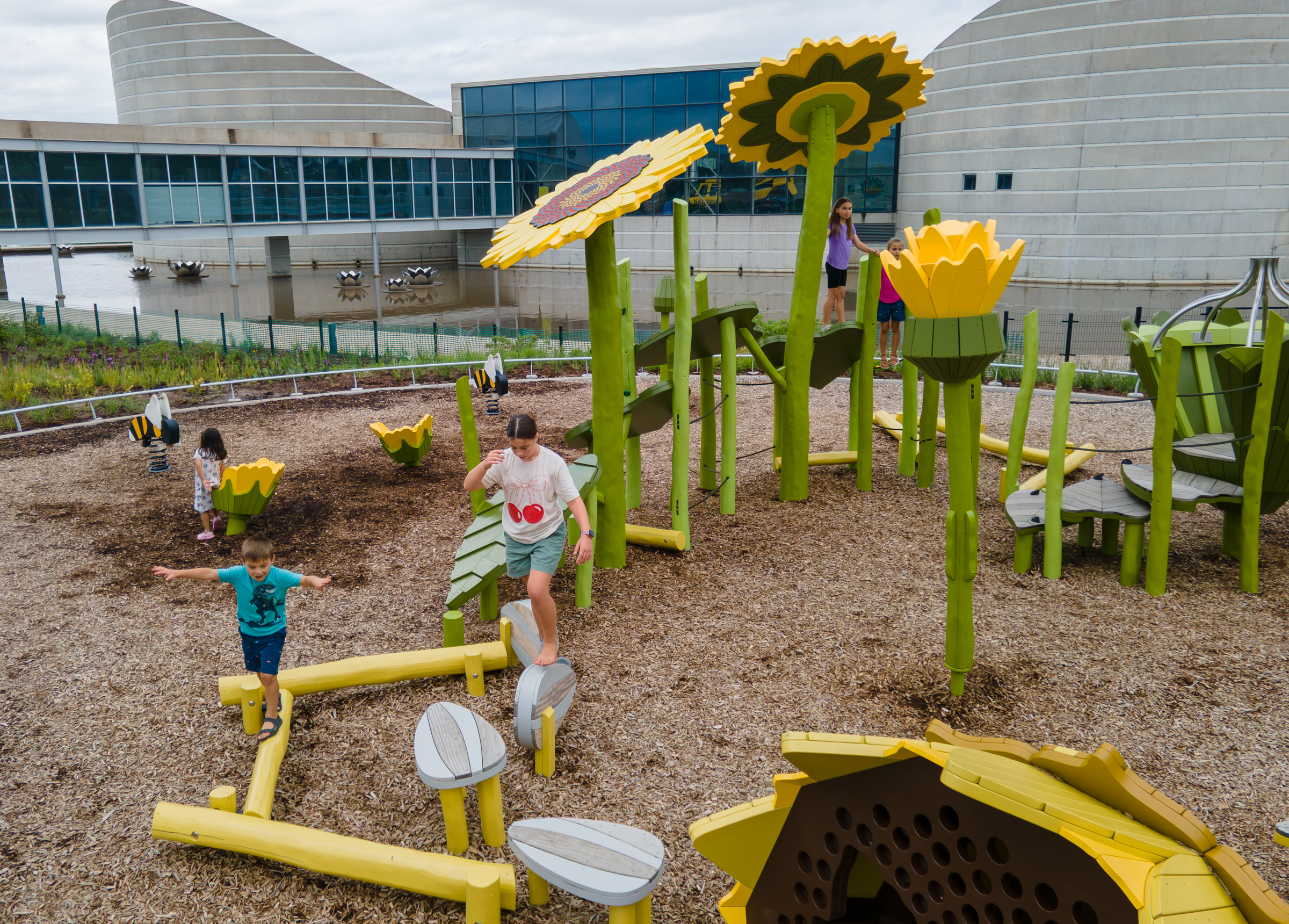 Kids playing at sunflower themed play area
