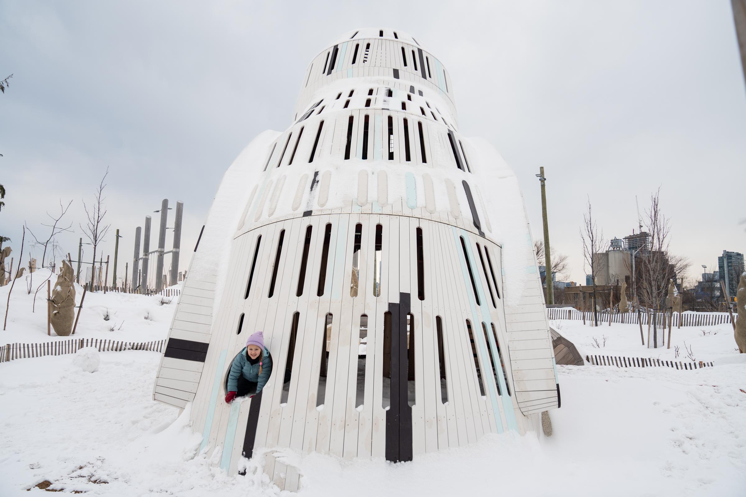 Rear view of huge wooden owl playground structure