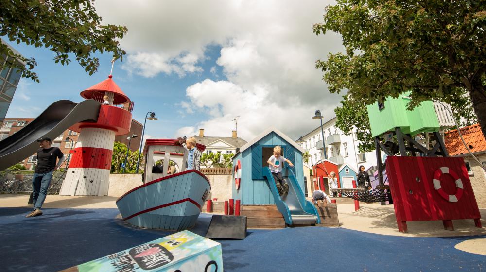 Kids playing at fishing village playground