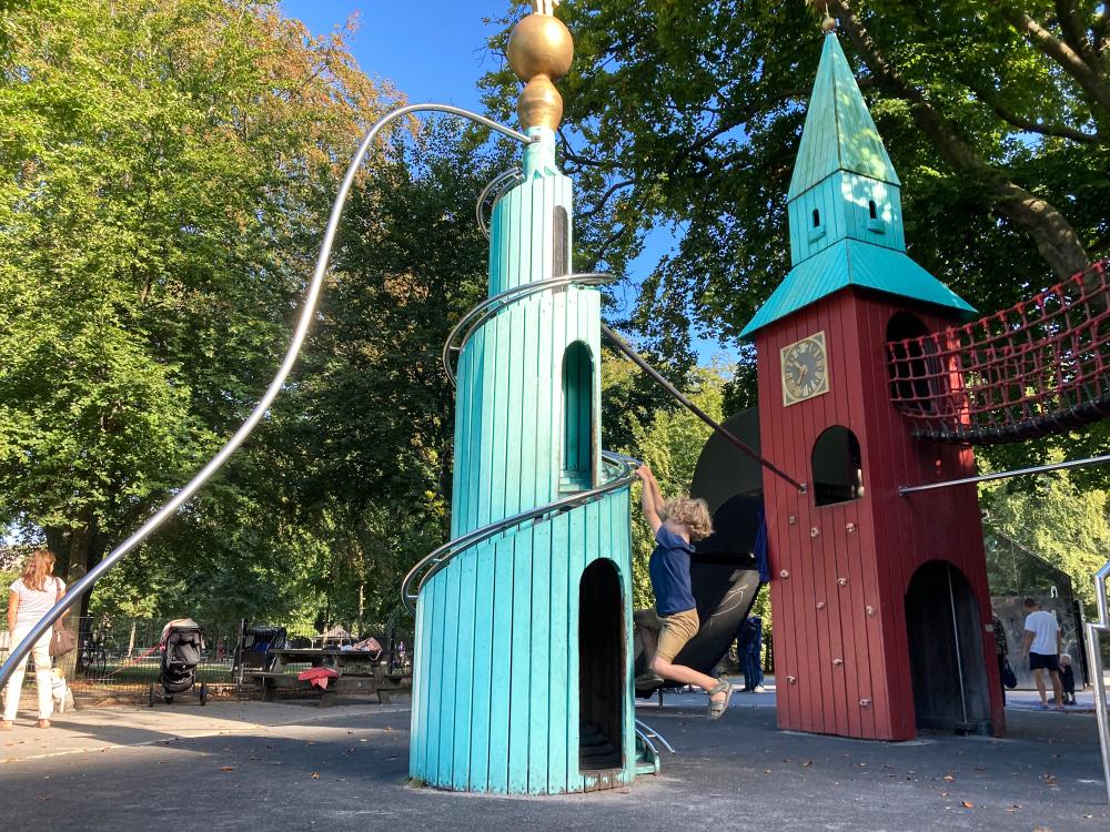 Boy climbing at Tower playground