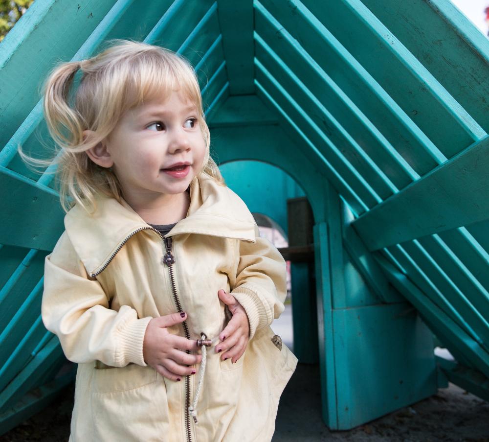 Girl playing at tower playground