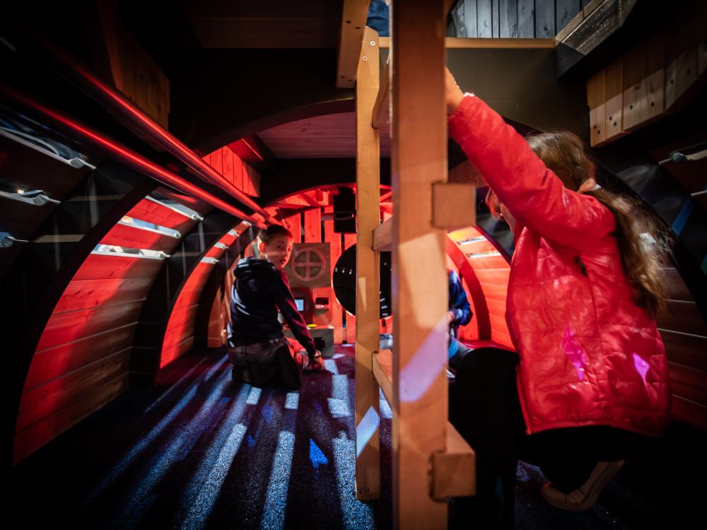 kids playing inside playground submarine