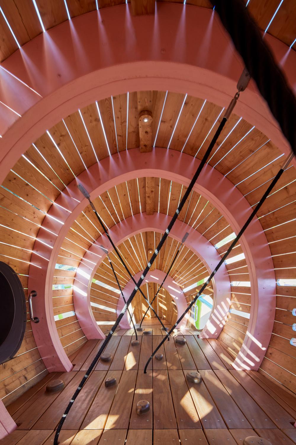 Interior of wooden playground feature with ropes and details