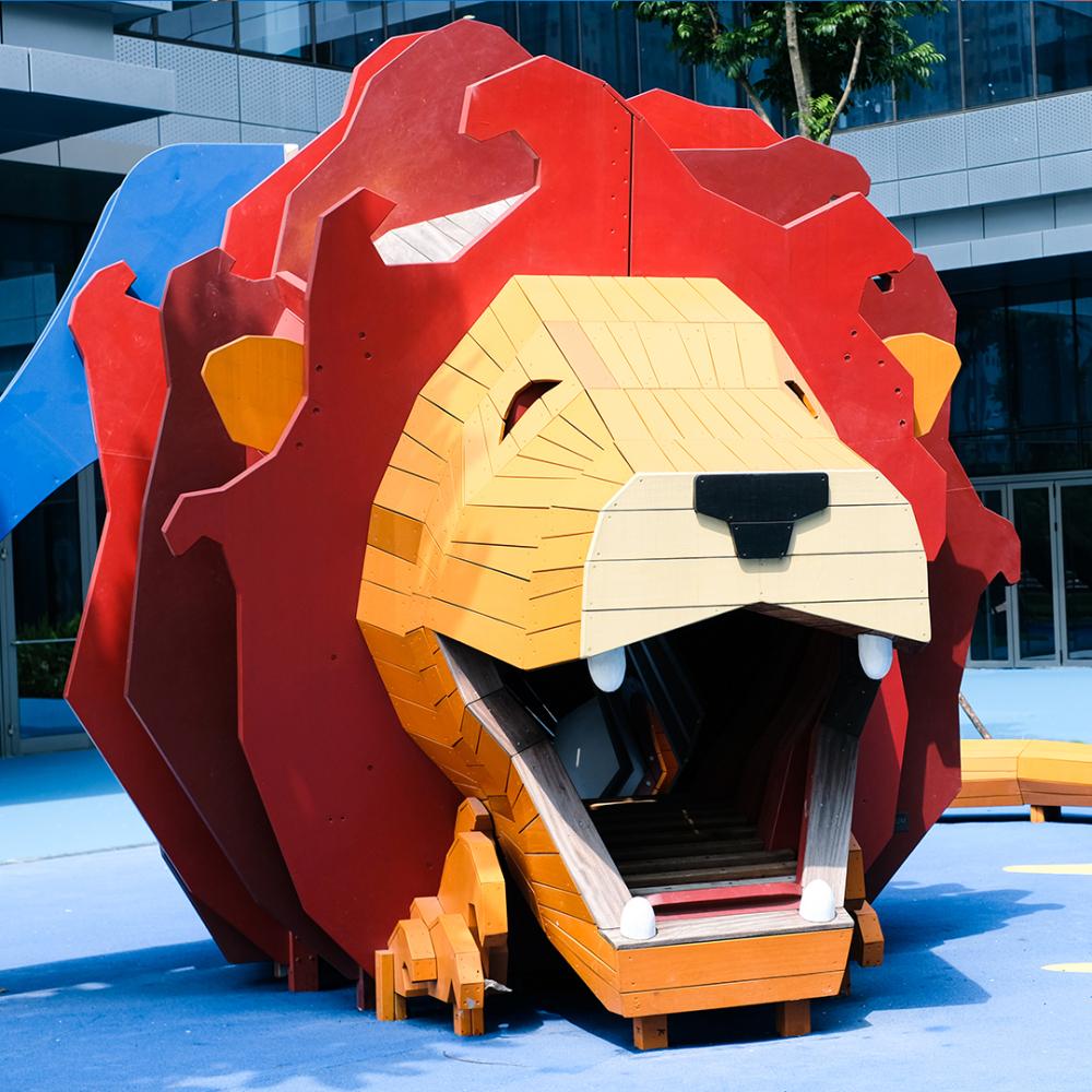 Front view of big wooden lion playground