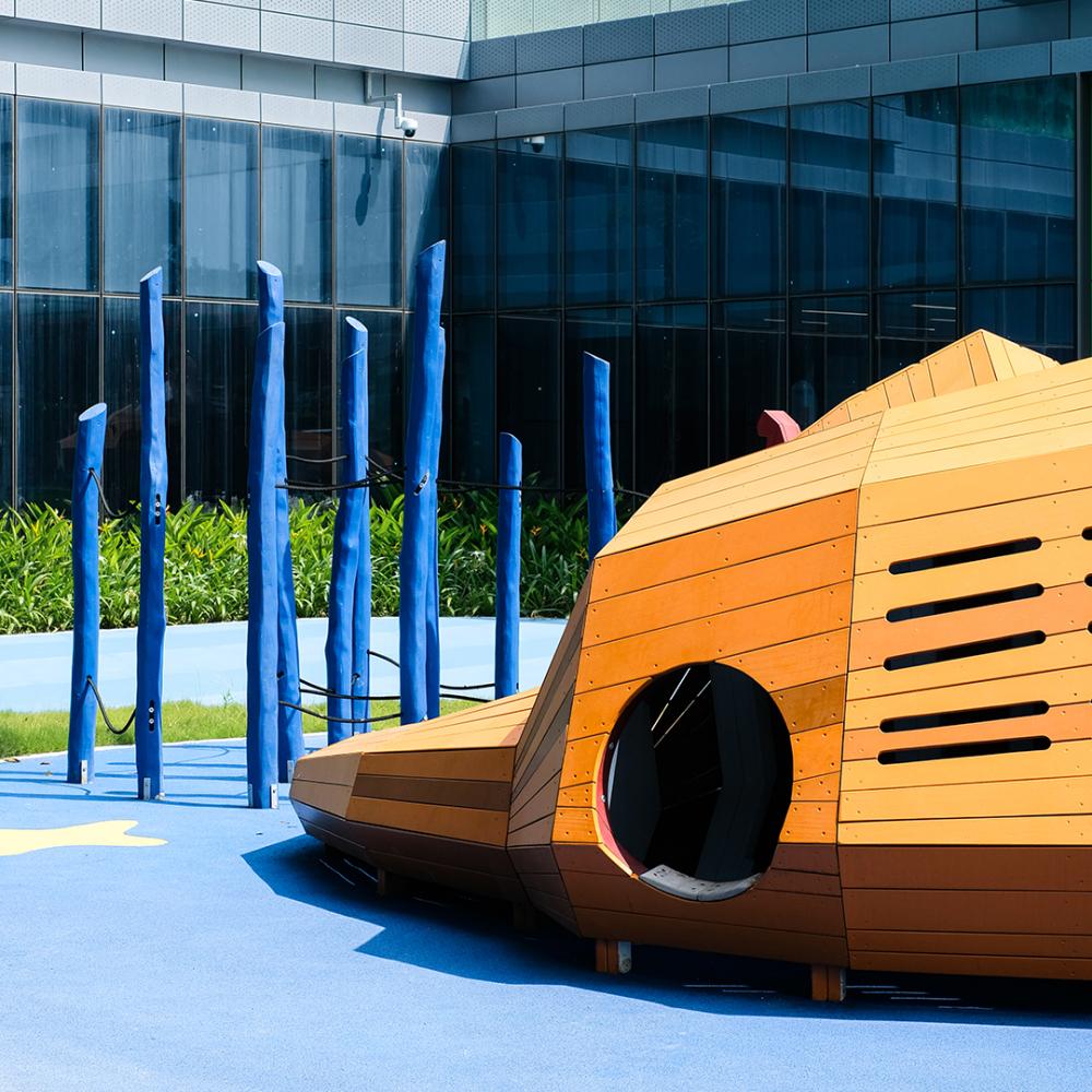 Opening to wooden lion playground climber