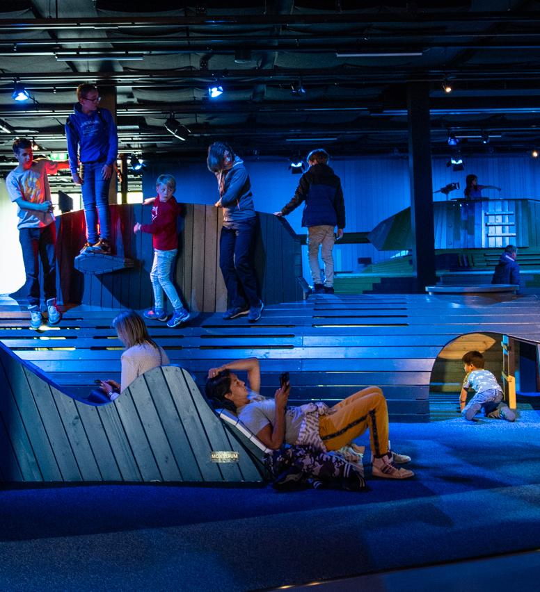Adults relaxing at playground