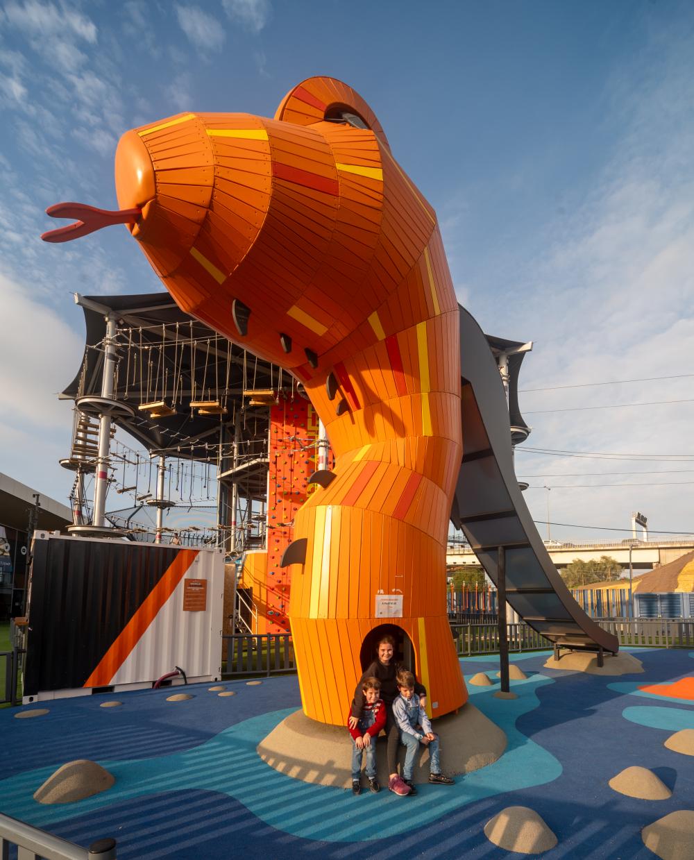 The head of a wooden sea dragon play feature at playground