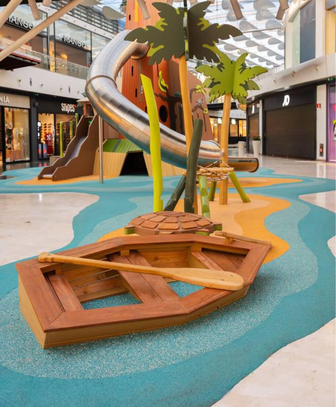 Close-up view of turtle and wooden boat at volcano playground