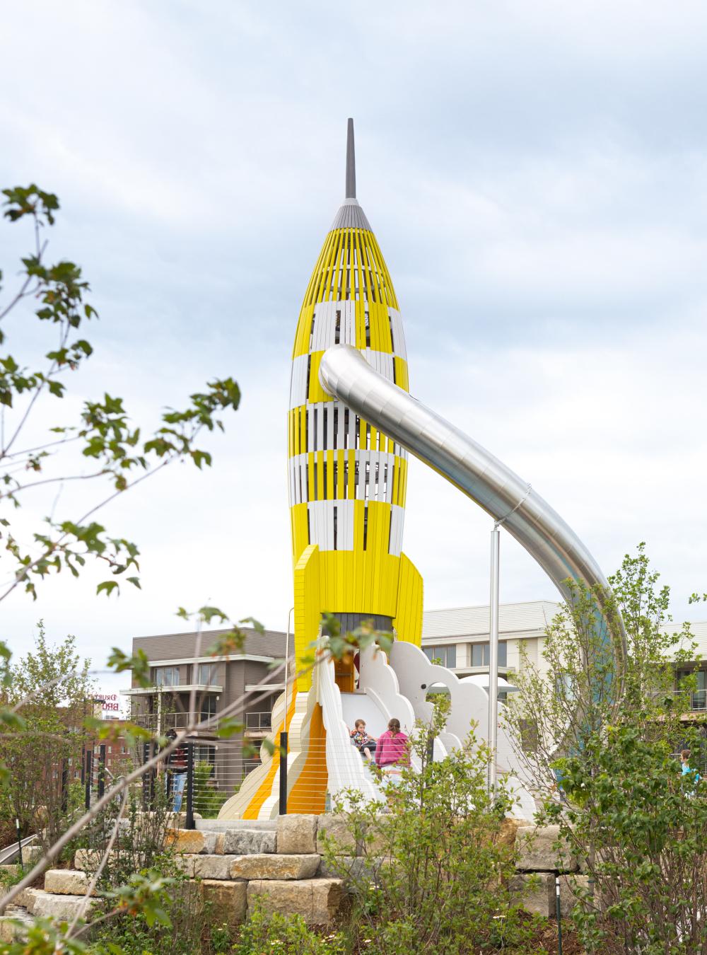 Big yellow and white wooden rocket at playground